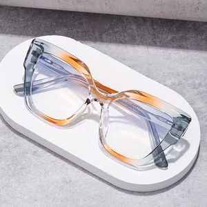 Elegant cat-eye blue light blocking glasses with gradient grey and amber frames