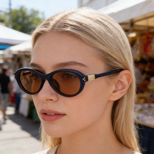 Lunettes de soleil ovales polarisées à monture bleu foncé avec détails en métal doré