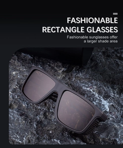 Close-up of square polarized sunglasses with matte frame on stone texture background