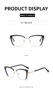 Detail of cat-eye eyewear frame in black and gold finish with photochromic lens feature