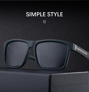 Close-up of matte dark green square frame sunglasses with metallic hinge detailing