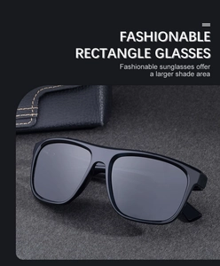 Close-up of black square polarized sunglasses on grey felt with matching leather case