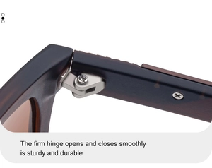 Macro shot of durable silver metal reinforced hinges on brown tortoiseshell sunglasses