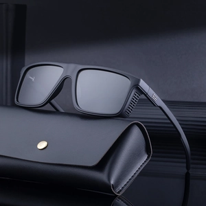 Fashionable square polarized sunglasses with a leather case and gold buckle on a dark background