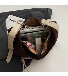 Interior view of large brown tote bag showing storage for tablet, books, and umbrella