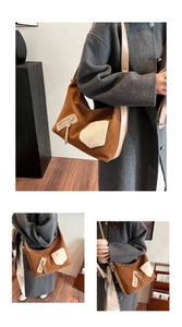 Detail of dark brown shoulder bag with white plush patch and beige leather strap