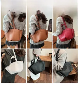 Detailed views of leather tote bags in various colors worn by a model in a cozy cafe