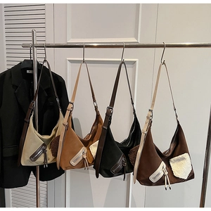Detail of four large tote bags showing matte leather and shearling pocket textures