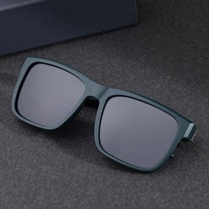 Classic square dark green polarized sunglasses with gray lenses for men on felt background