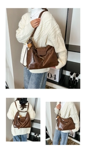 Detail of dark brown leather convertible bag with metal rivets and a cute bear charm
