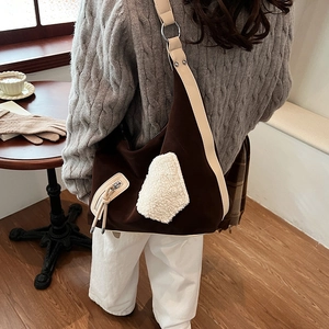Brown canvas shoulder bag with white faux fur patchwork and leather strap for winter