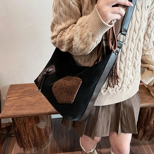 Winter vintage hobo bag with contrast faux shearling patches and brown leather trim