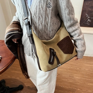 Retro mustard suede shoulder bag with brown shearling patchwork and adjustable strap