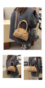 Detail of khaki pleated shell bag featuring vertical quilted texture and silver buckle