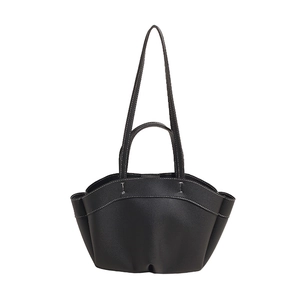Minimalist black tote bag with white contrast stitching and lychee grain leather texture
