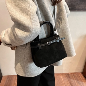 Retro black suede crossbody square bag for women styled with a professional suit