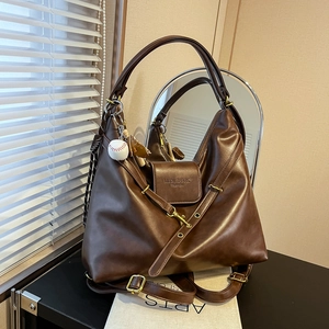 Vintage dark brown large tote bag in faux leather with shoulder strap and ball charm