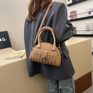 Chic khaki shell bag with quilted leather texture and adjustable strap for women