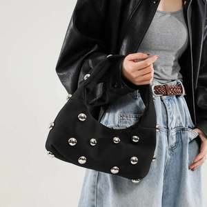 Chic black hobo bag with large silver studs, stylish shoulder bag for women outfit