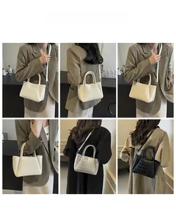 Detailed views of quilted leather bucket bag in cream, silver, and black on model