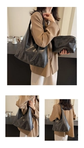 Detail of minimalist black hobo tote bag with matching pouch and soft leather texture