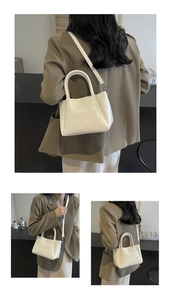 Detail of cream white quilted PU leather handbag featuring elegant rhombic pattern and handle