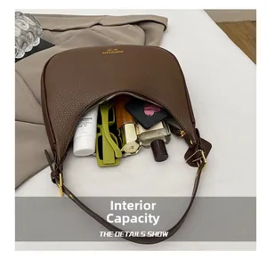Detail view of deep brown hobo bag interior showing ample capacity for daily essentials