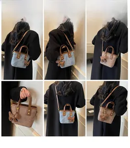 Detailed views of vintage mini bucket bag with leather puppy charm and styling options