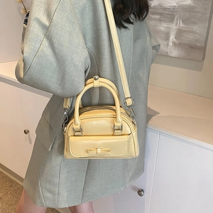 Light yellow mini shell bag with decorative bow and silver hardware for women