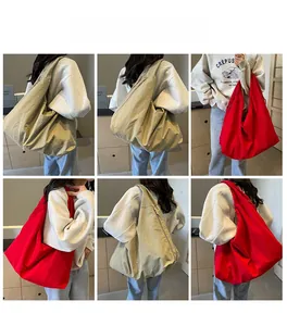 Close-up of lightweight parachute fabric shoulder bag with large capacity and hobo style