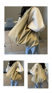 Detail view of khaki large capacity tote bag with minimalist wrinkled nylon texture