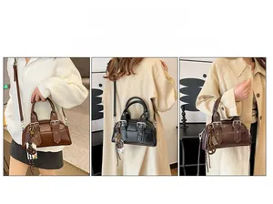 Détails des options de transport du sac Boston vintage disponible en trois coloris