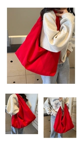 Detail shot of the spacious red canvas hobo bag showing high-density fabric texture