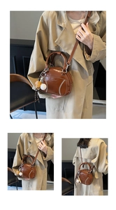 Macro detail of retro brown bowling bag featuring white baseball stitching and logo