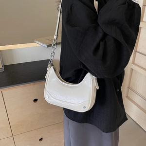 Chic beige wrinkled leather hobo bag featuring a stylish metal chain strap for women