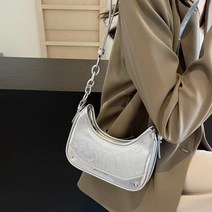 Metallic silver hobo underarm bag with cracked texture and stylish metal chain strap
