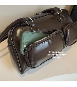 Deep brown glossy bowling bag with functional front zipper pocket for smartphone storage