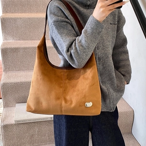 Brown suede hobo shoulder bag for women with silver logo and spacious retro design