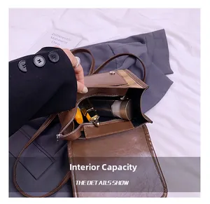 Detail view of brown leather bag interior showing spacious storage for daily essentials