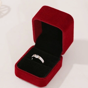 Elegant silver adjustable ring with round solitaire moissanite in a red velvet gift box