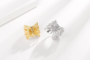 Close-up of gothic spider rings in gold and silver finish with micro-zirconia inlays