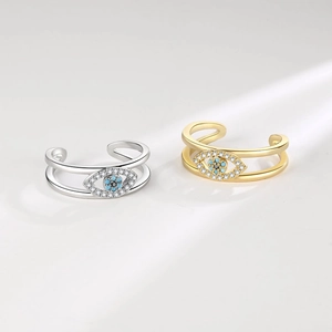 Bohemian evil eye open ring set in gold and silver finish with blue crystal inlay