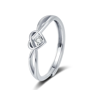 Minimalist silver heart knot open ring with cubic zirconia inlay on white background
