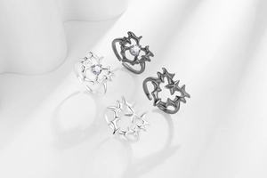 Detail of dark gothic thorn heart rings with sparkling crystals in silver and gunmetal black