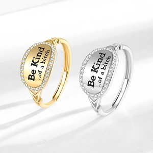 Adjustable letter ring set with Be Kind engraving and sparkling white zircon halo