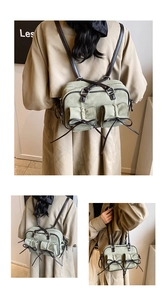 Détail du sac en toile verte avec nœuds en cuir et double style de bandoulière