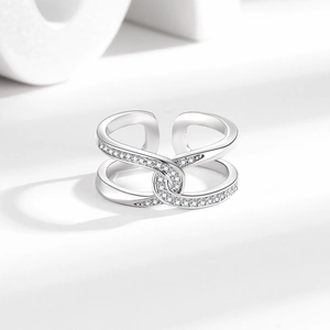 Silver interlocking crossover open ring with pavé cubic zirconia accents in a modern style