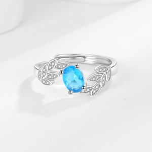 Leaf engagement ring with oval blue zircon and tiny silver stones in adjustable size