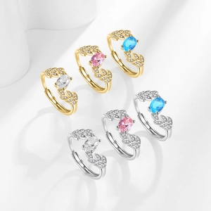 Adjustable leaf engagement ring with oval zircon stones in silver and gold plating