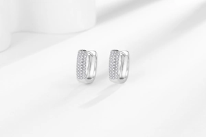 Detailed view of silver hoop earrings featuring micro-pave cubic zirconia stones
